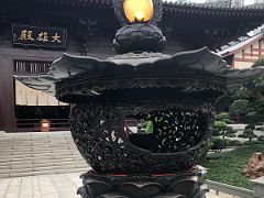 07B Ornate bronze Lamp of Wisdom in the centre of the second courtyard has intricate scrollwork and lotus petals Chi Lin Nunnery Hong Kong